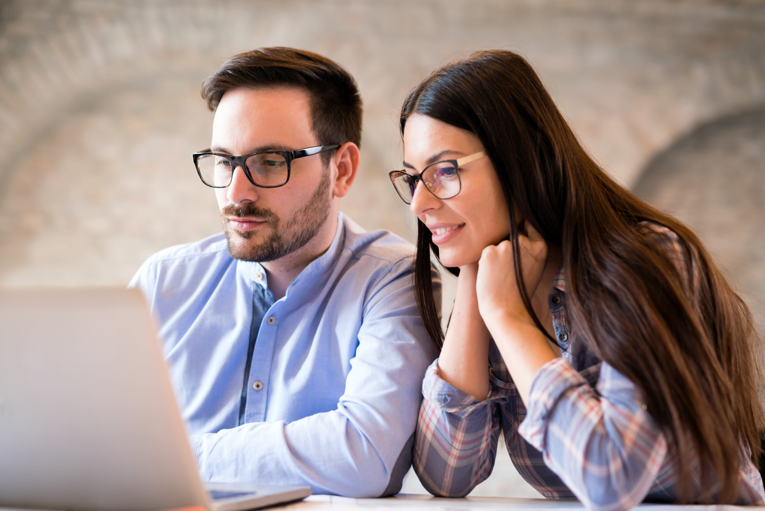 Programmers cooperating at information technology company